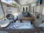 Outdoor seating and dining area under cover at Key Lime Cottage